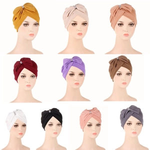 Detail display of cross front headwrap beanies in ten colors with crystal bows