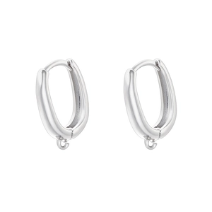Detailed view of silver oval hoop earrings with bottom hanging loops and polished finish