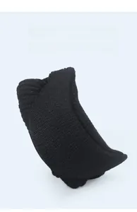 Detail of black knitted beanie showing soft ribbed texture and foldable design