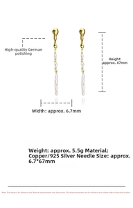 Detailed view of long baroque pearl earrings with dimensions 6.7mm by 67mm shown on white