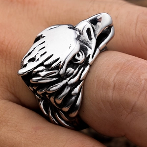 Detailed view of vintage eagle head ring with intricate 3D carvings on stainless steel
