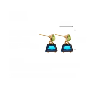 Detail showing geometric earrings dimensions with blue trapezoid and green rhinestones