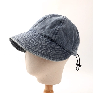 Detail of vintage navy denim sun hat featuring a black elastic adjustable drawstring cord