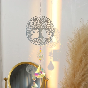 Detailed view of Tree of Life suncatcher with crystal prisms creating rainbow light reflections