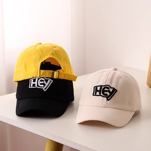Kids baseball cap with HEY embroidery, available in yellow, black, and beige colors