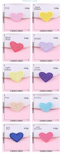 Macro detail of 10-color heart embroidery patches with dimensions and scale