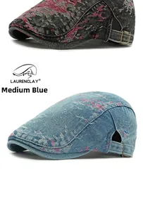 Detail of washed denim beret featuring vintage pink floral pattern and metal buckle