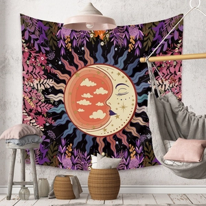 Cozy home setting featuring a bohemian sun and moon tapestry with floral star patterns