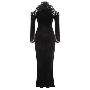 Detail of elegant black velvet dress back with pearls, crystals, and shoulder cutouts