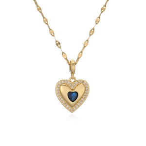 Golden necklace with blue heart pendant and cubic zirconia halo on white background