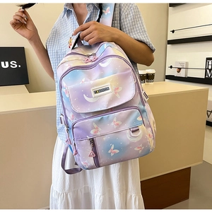 Detail of purple gradient backpack with butterfly print and fashion rubber badge