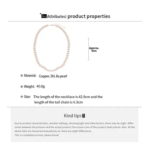 Detailed view of beaded pearl necklace with copper arc accents and sizing specifications