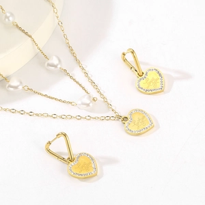 Golden heart jewelry set with LOVE YOU engraving, crystals, and white pearls