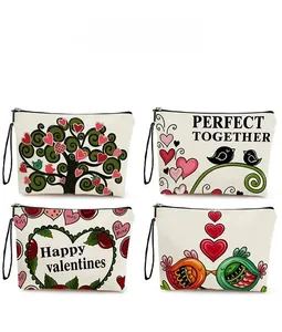 Matrix view of four canvas makeup bags with festive Valentine prints and wrist straps