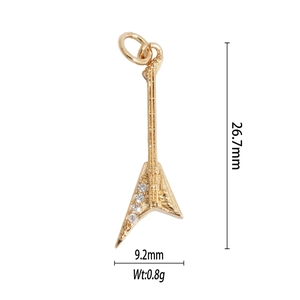 Detailed view of a gold electric guitar pendant with zircons and size measurements