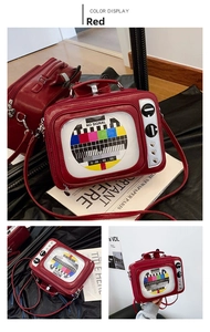Detail of red television shaped bag with signal screen pattern and heart charms