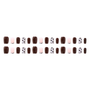 Square press-on nails with dark brown gloss and cream cow print patterns on white background