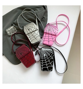 Detail of coffin-shaped cross-body bags in shiny PU leather with spider web patterns