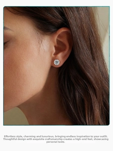 Close-up of a model wearing a bezel-set s925 silver stud earring with sparkling cubic zirconia