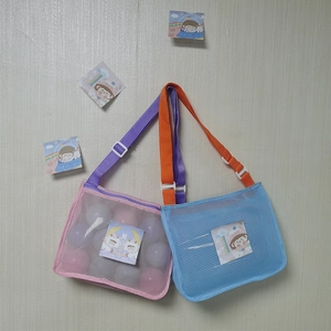 Mesh shell bags in pink and blue with adjustable straps for kids beach toy storage
