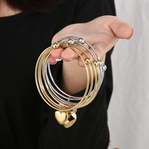 Fashionable double-layer stainless steel bangle with heart pendant in gold and silver
