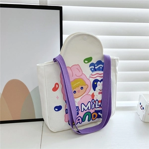 Close-up of white canvas tote bag with purple straps and cute rabbit cartoon graphics