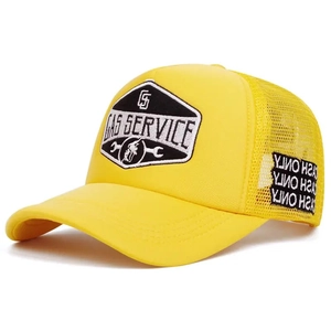 Detail of yellow trucker hat with GAS SERVICE embroidery and breathable mesh back