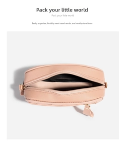 Top view of compact crossbody bag with metal zipper closure and dark lining