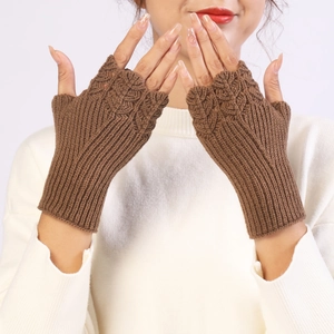 Close-up of brown cable knit fingerless gloves with extended ribbed cuffs for women
