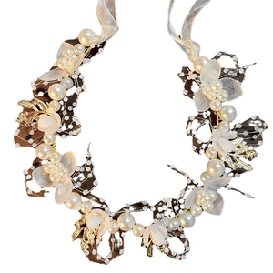 Floral hair wreath with golden leaves, white pearls and flowers on a clean white background