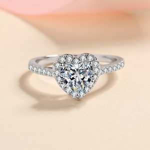 Elegant 925 silver ring featuring a heart-cut diamond centerpiece with micro-pave setting