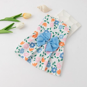 Floral print dog dress with a large blue bow tie for small pets on a clean white background