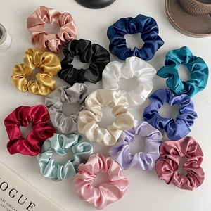 Collection of premium satin silk scrunchies in various colors for elegant hair styling
