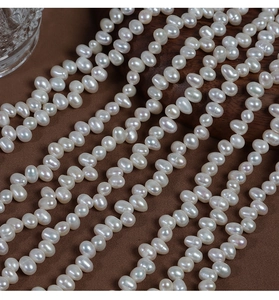 Close-up of 6-9mm baroque irregular freshwater pearls showing natural luster and creamy white tone