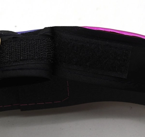 Detail of black fabric hat with pink metallic trim and secure Velcro fastener