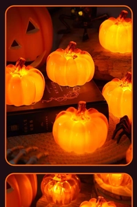 Group of LED pumpkin lights glowing warmly on a wooden table with spooky props