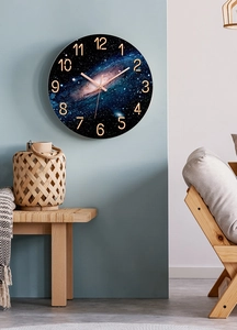 Detailed view of the 30cm cosmic galaxy wall clock with rose gold hands and 3D numbers