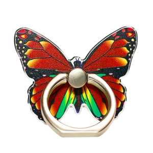 Macro shot of colorful butterfly phone ring holder with clear acrylic and gold metal