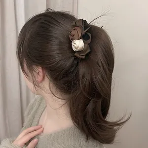 Elegant retro rose pearl banana hair clip worn on a ponytail for women's hairstyle