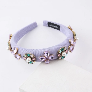 Baroque lavender padded headband featuring crystals and pearls shown at 45-degree angle