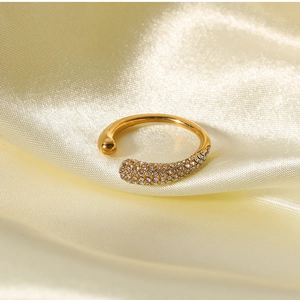 Detailed macro view of 18k gold plated open cuff ring with shimmering pave zircon stones