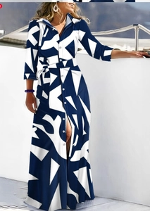 Detail of floral geometric print shirt dress featuring a classic collar and waist tie