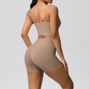 Detail view of the khaki ribbed yoga set featuring a backless bra and high waist shorts