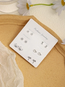 Set of 6 silver alloy stud earrings featuring heart, flower, and butterfly designs