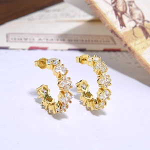 Minimalist gold-plated C-shaped earrings with marquise zirconia inlay in a 45-degree view