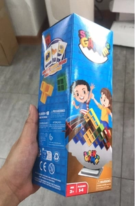 Detailed view of children stacking game packaging with colorful blocks and game cards