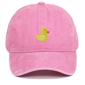 Detailed close-up of yellow duck embroidery on a washed pink cotton baseball cap
