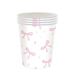Detailed close-up of eco-friendly pink bow paper cups for girl birthday party decor