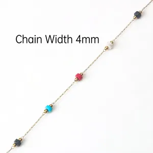 Detail of 4mm gold handmade chain with colorful stone beads and evil eye accents