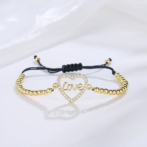Adjustable gold plated heart charm bracelet with Love engraving and zircon inlay